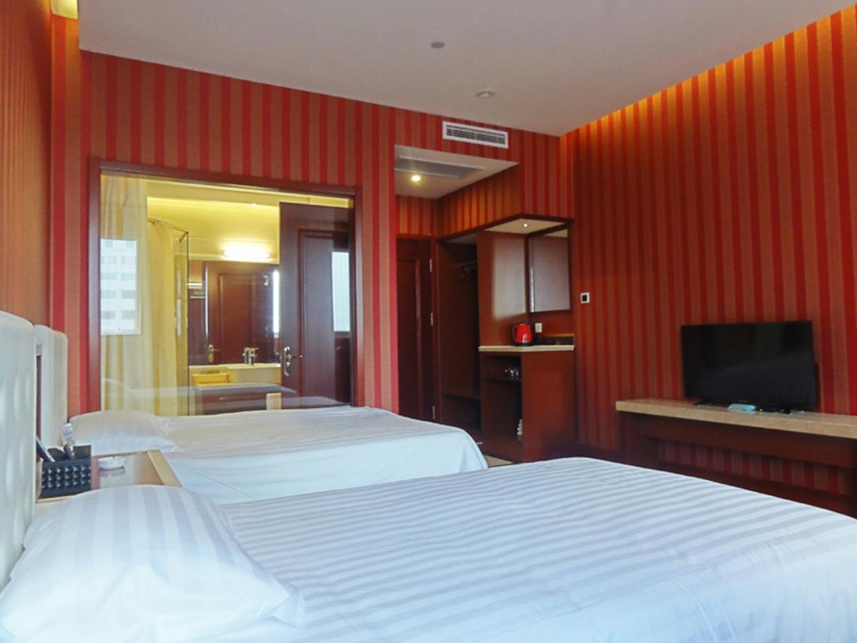 Qingdao Hua Qi Kaiserdom Hotel Bagian luar foto