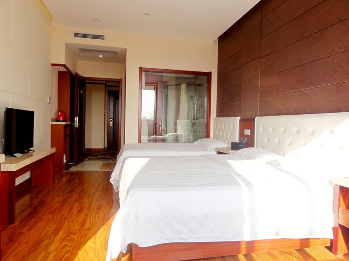 Qingdao Hua Qi Kaiserdom Hotel Bagian luar foto