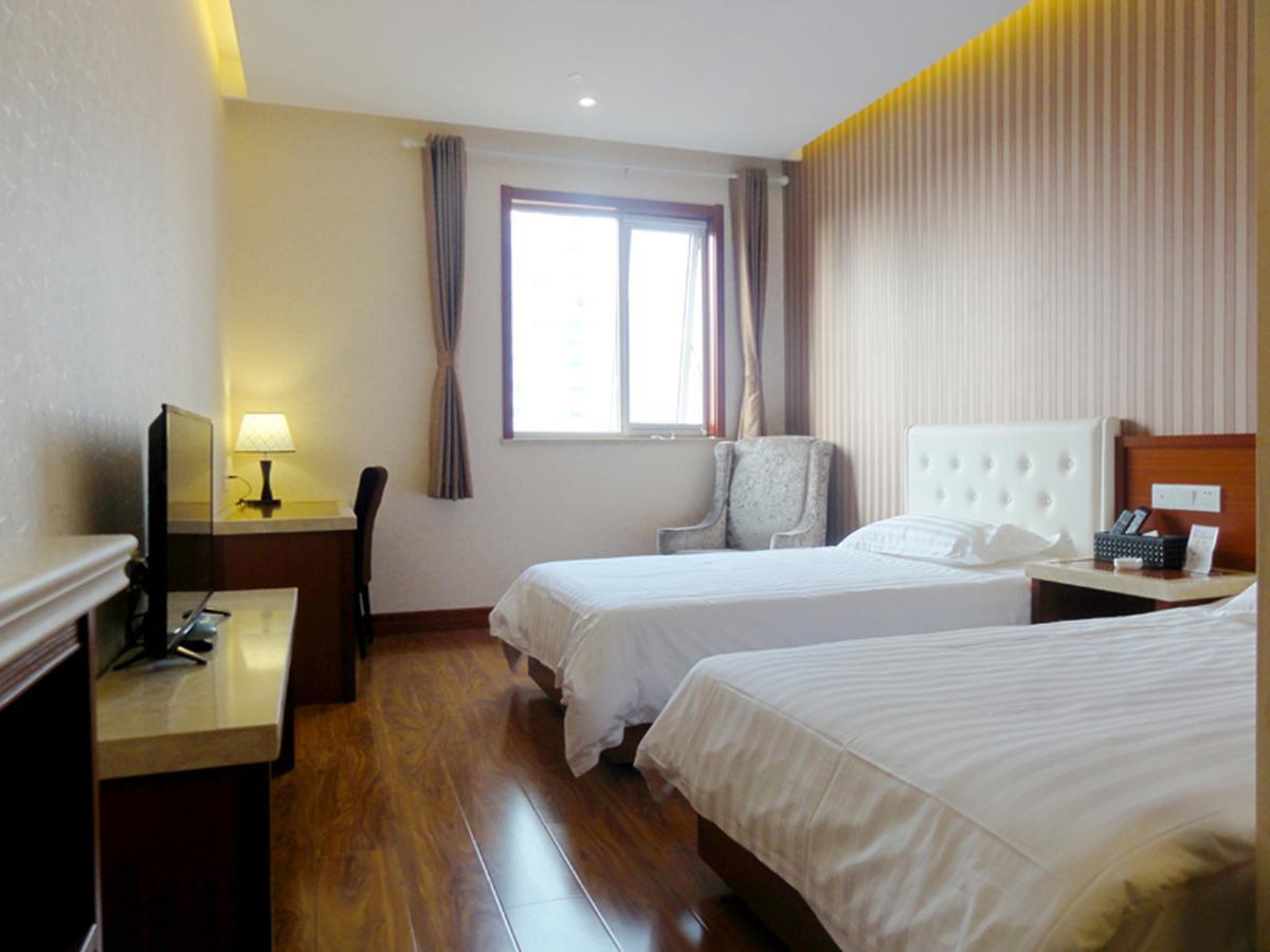 Qingdao Hua Qi Kaiserdom Hotel Bagian luar foto