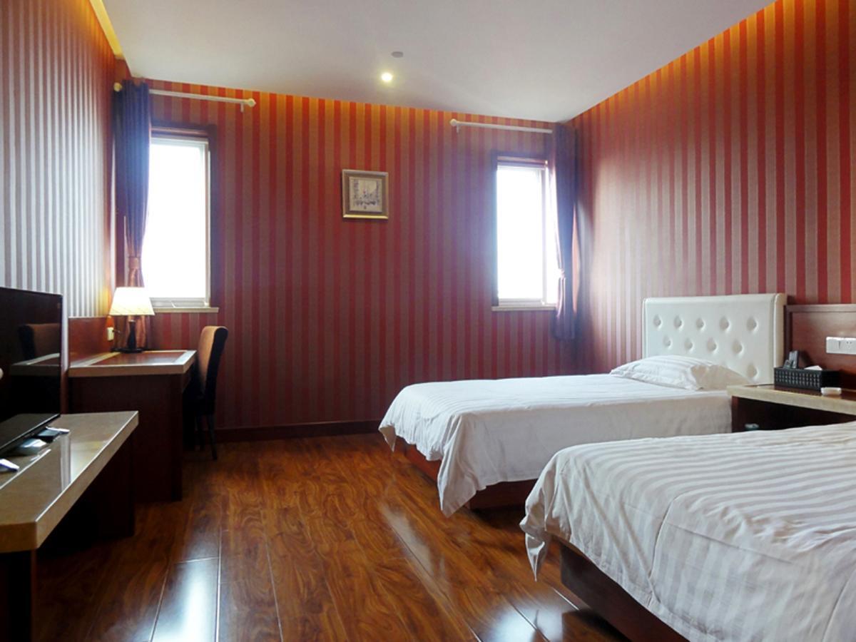 Qingdao Hua Qi Kaiserdom Hotel Bagian luar foto