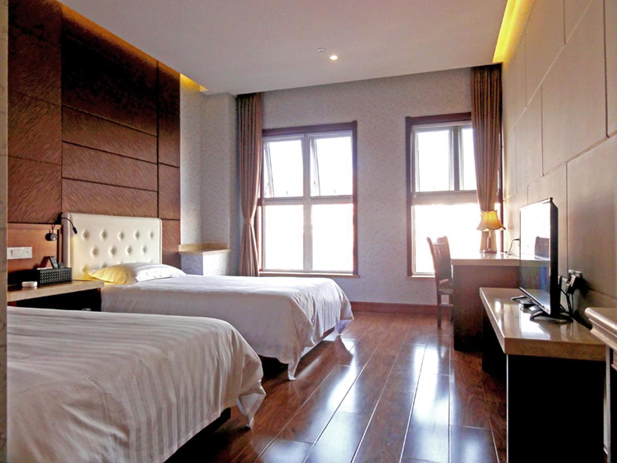 Qingdao Hua Qi Kaiserdom Hotel Bagian luar foto