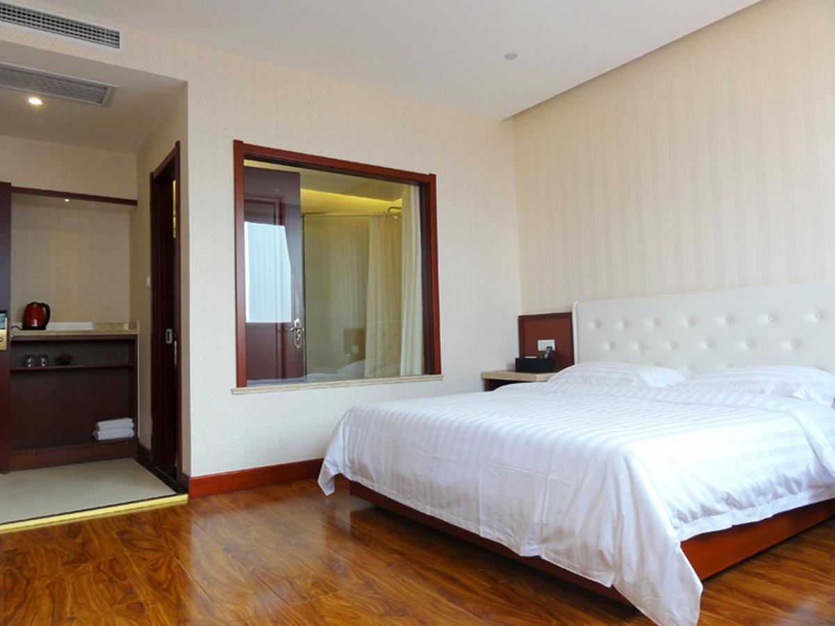 Qingdao Hua Qi Kaiserdom Hotel Bagian luar foto