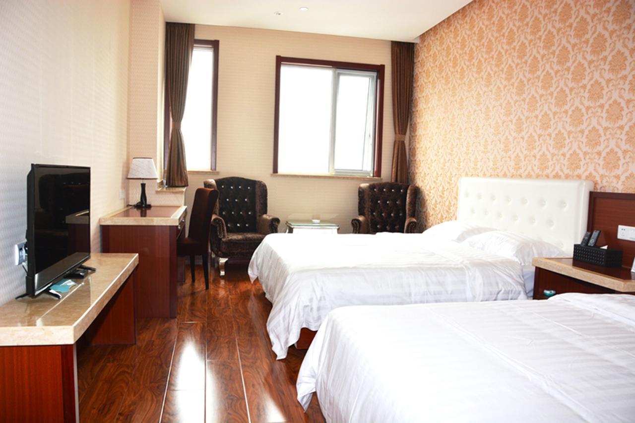 Qingdao Hua Qi Kaiserdom Hotel Bagian luar foto